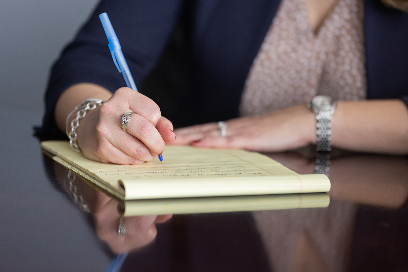 family attorney writing notes on a legal pad - Feinman & Childs Family Law