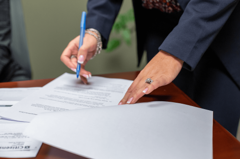 Family Lawyer signing papers |  Feinman & Childs Family Law